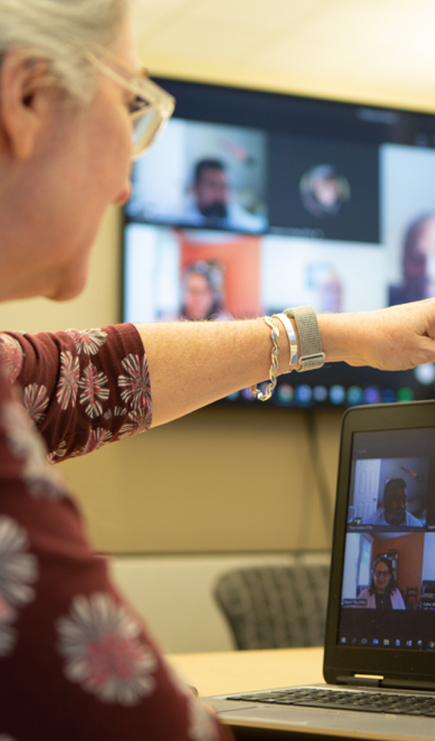 careers-spot-benefits woman pointing to laptop