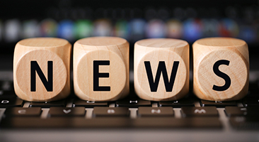 Wooded squares spelling NEWS